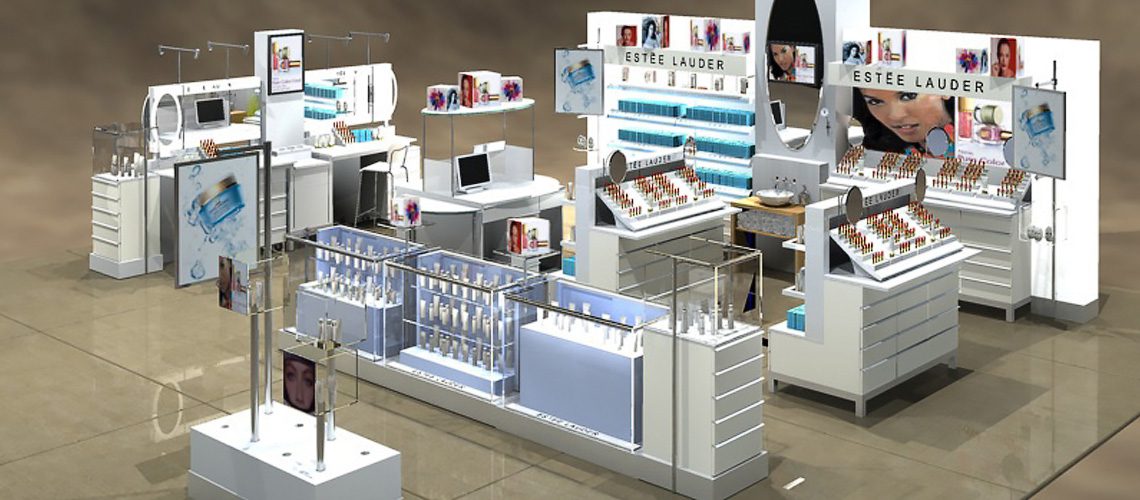 A modern, well-lit Estée Lauder cosmetics display in a store, showcasing various products with promotional images and mirrors. The setup includes counters, shelves of makeup, and digital screens.